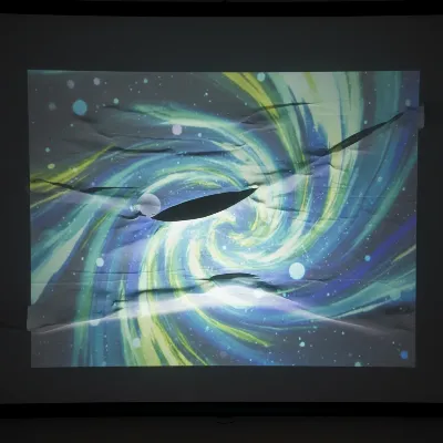 A close-up of a projector screen with noticeable wrinkles distorting the image, highlighting a common problem.